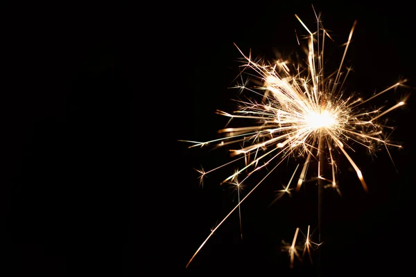 Christmas sparkler on black background — Stock Photo, Image