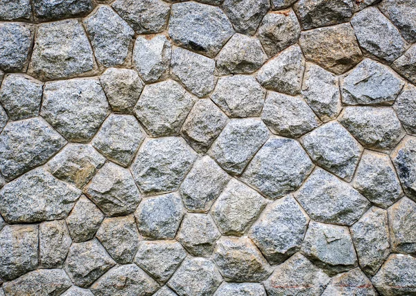 Granieten stenen muur achtergrond — Stockfoto