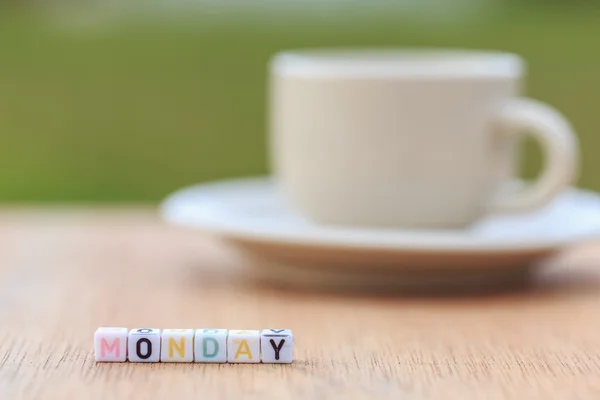 Letter beads and a coffee cup on table — Stock Photo, Image