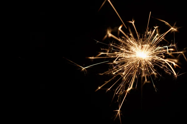 Christmas sparkler on black background — Stock Photo, Image