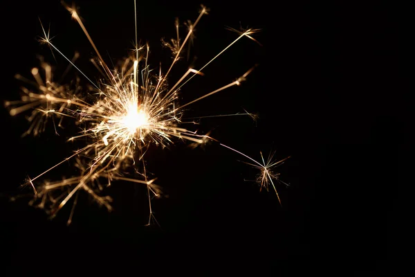 Christmas sparkler on black background — Stock Photo, Image