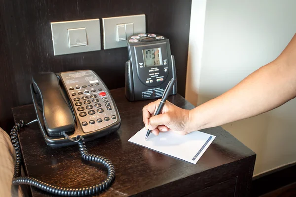 Hand holding pen with telephone — Stock Photo, Image