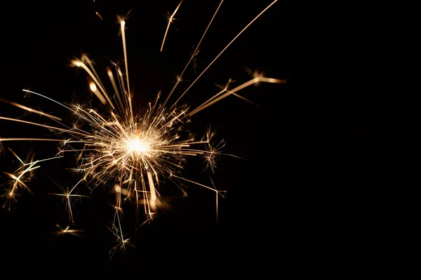 Christmas sparkler on black background — Stock Photo, Image