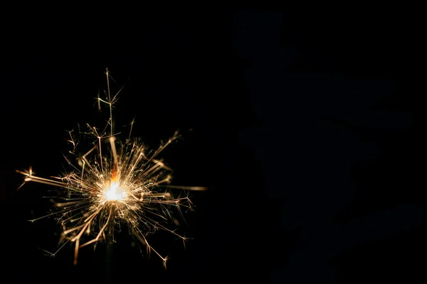 Christmas sparkler on black background — Stock Photo, Image