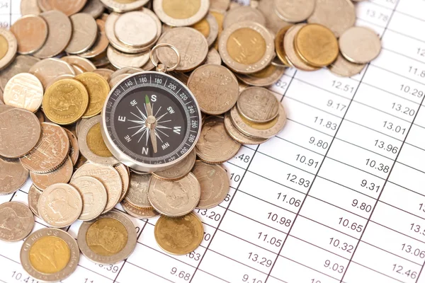 Compass on coin stack — Stock Photo, Image