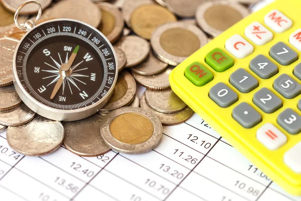Compass on coin stack — Stock Photo, Image