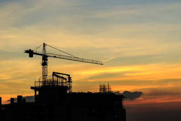 silhouette of crane in construction site