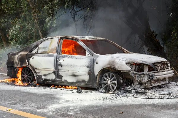 Car burning on roadside