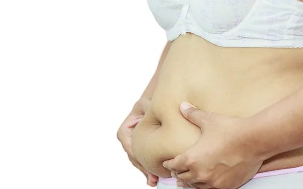 Frau kneift dicken Bauch — Stockfoto