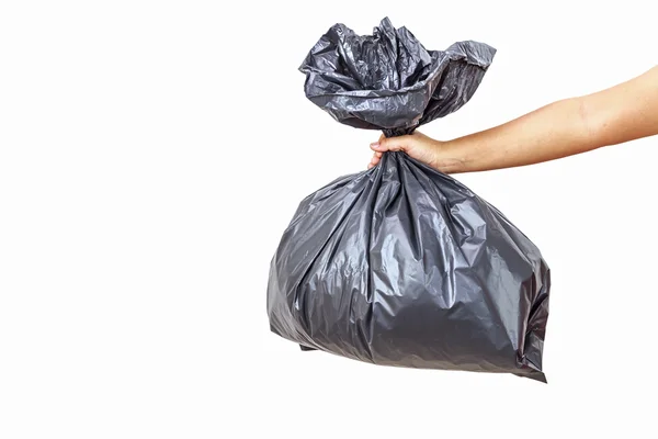 Mano con bolsa de basura negra — Foto de Stock
