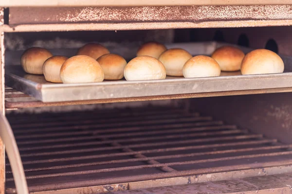 Buns on metal plate — Stock Photo, Image