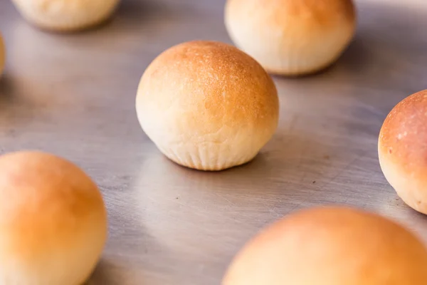 Buns on metal plate — Stock Photo, Image