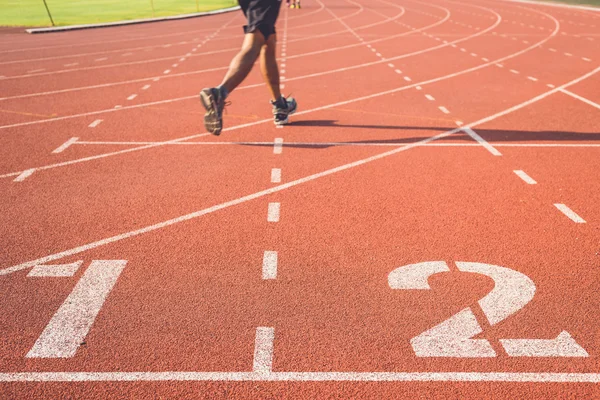 Pista para correr con números blancos — Foto de Stock