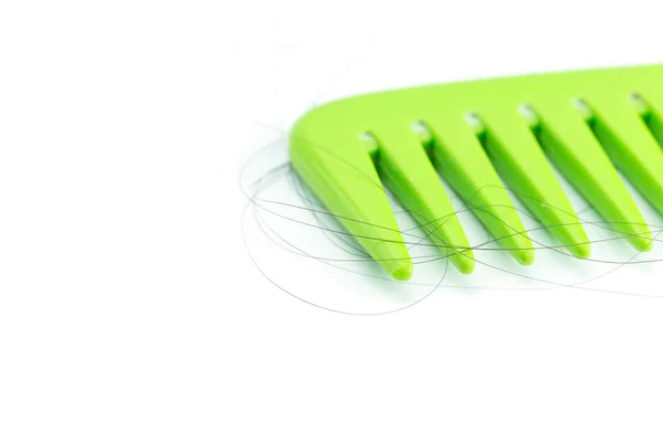 Pettine verde con capelli — Foto Stock