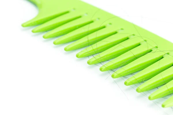 Green comb with hair — Stock Photo, Image