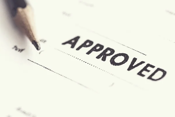 Approved stamp on paper — Stock Photo, Image