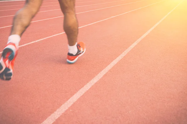 Runner voeten op stadion — Stockfoto