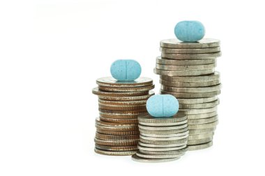 Medicine pills and coins stack clipart