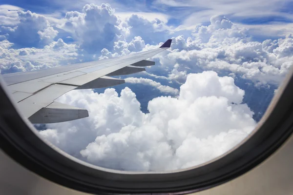 Cloud and wing of airplane — Stock Photo, Image