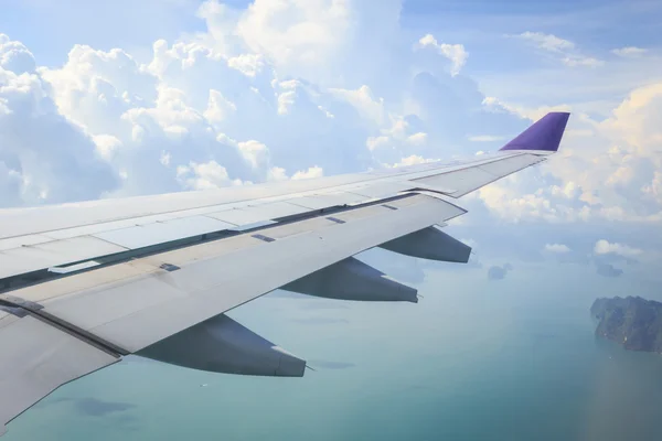 Cloud and wing of airplane — Stock Photo, Image