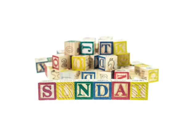 Sunday written in letter alphabet blocks — Stock fotografie