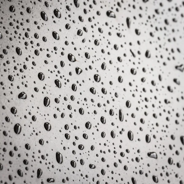 Drops on black stone texture — Stock Photo, Image