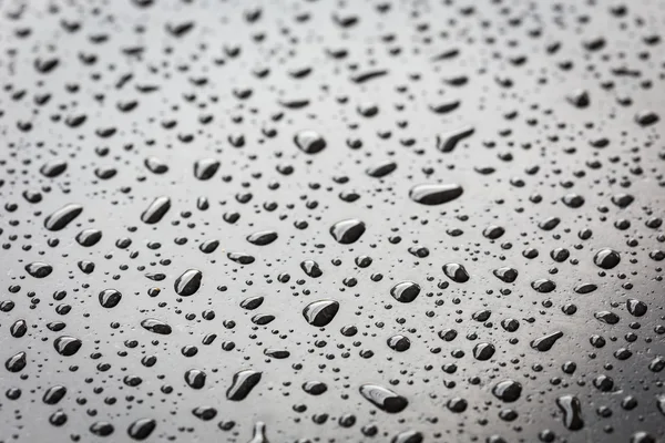 Drops on black stone texture — Stock Photo, Image