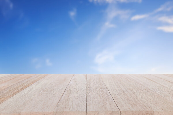 Close up, top of table and blurred blue sky background