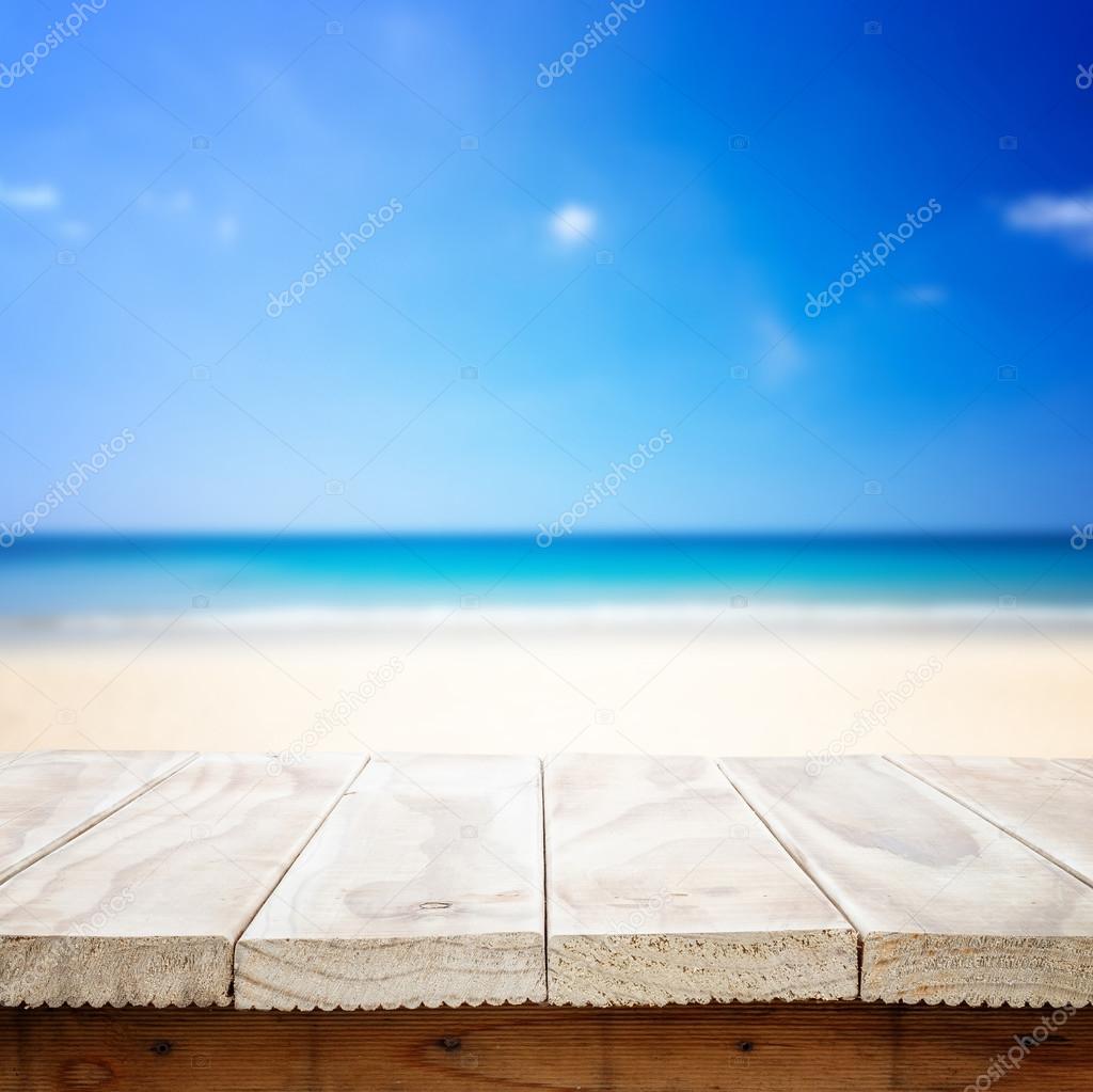 wooden table and tropical beach