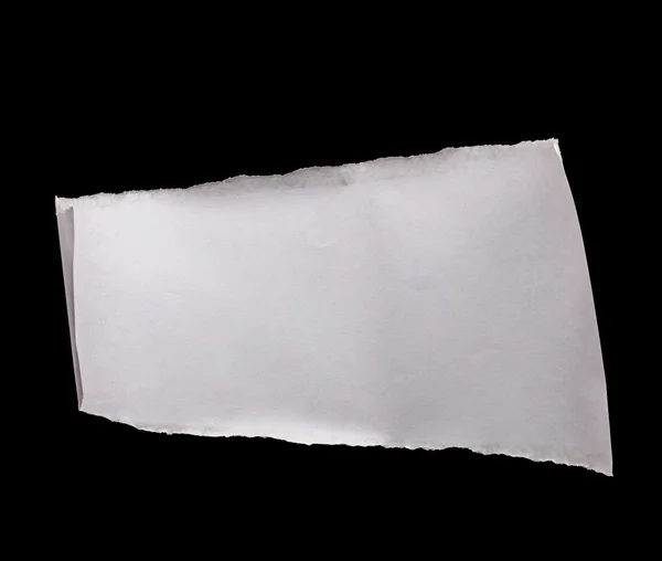 Pedaço de papel branco isolado em preto — Fotografia de Stock