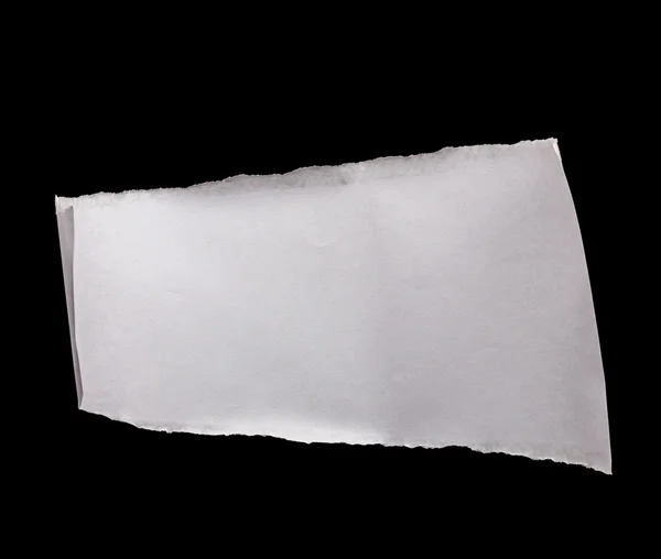 Piece of white paper isolated on black — Stock Photo, Image