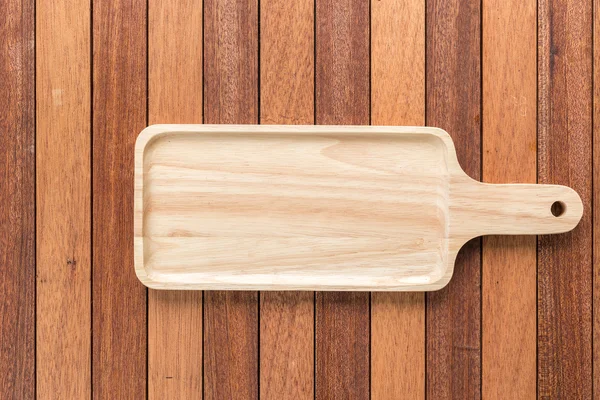 Empty wooden tray on wooden table — Stock Photo, Image