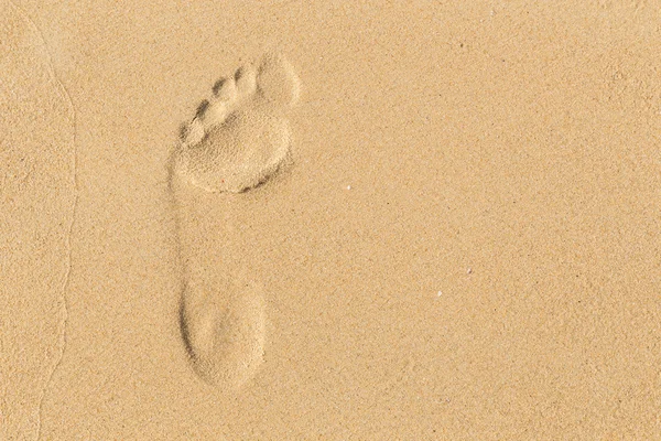 Foot prints on sand at the beach in the afternoon — Stock Photo, Image