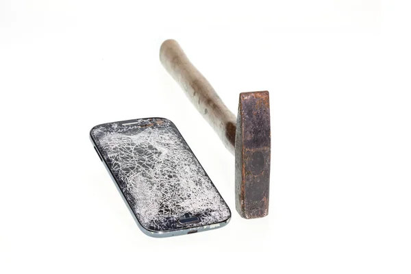 Hammer and broken smart phone isolated on white background — Stock Photo, Image