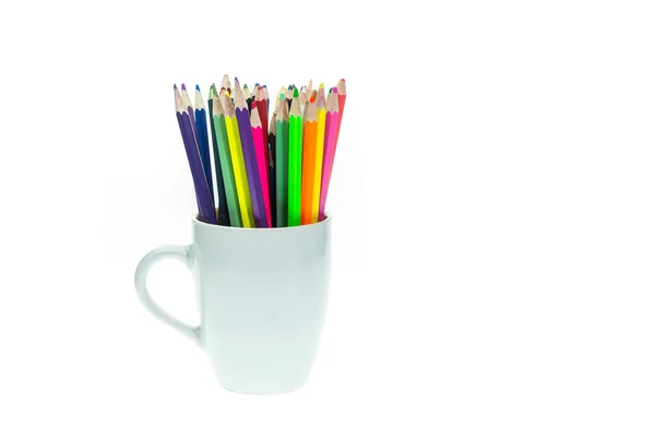 Colour pencils in white ceramic cup isolated on white background — Stock Photo, Image