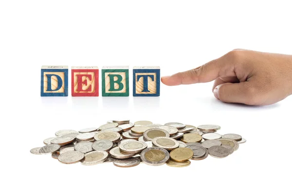 Pile of Thai money and "DEBT" write in colorful wood alphabet bl — Stock Photo, Image