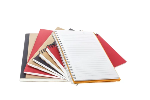 Fechar pilha de notebook isolado em branco — Fotografia de Stock