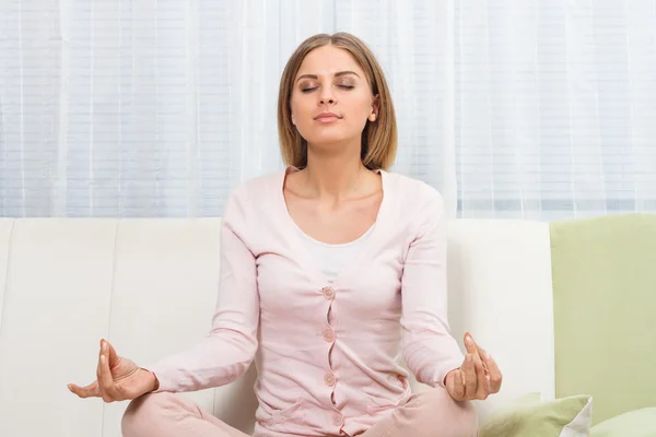 Beautiful woman is relaxing at home Stock Photo