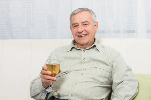 Senior man drinking wine — Stock Photo, Image