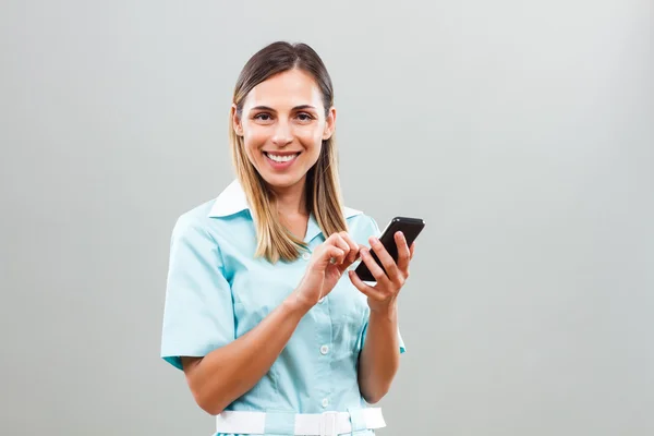 Nurse with mobile phone — Stock Photo, Image