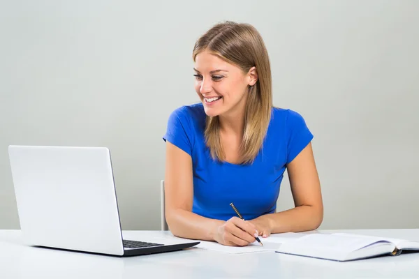 Student woman studying with laptop Stock Image