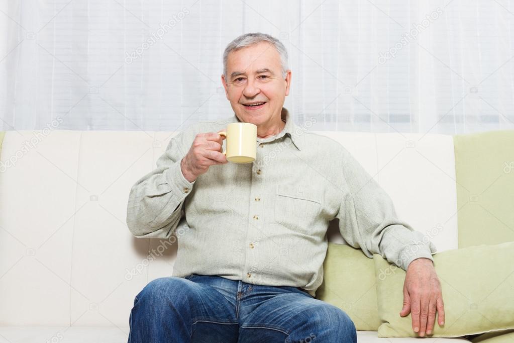 old man drinking tea