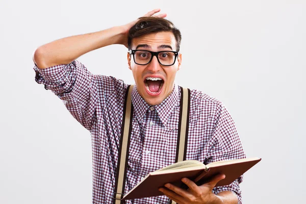 Nerdy man is in panic because he doesn't have too much time for learning — Stock Photo, Image