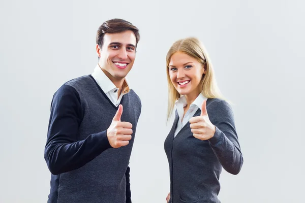 Succesvolle zakenvrouw en zakenman tonen duimen omhoog — Stockfoto