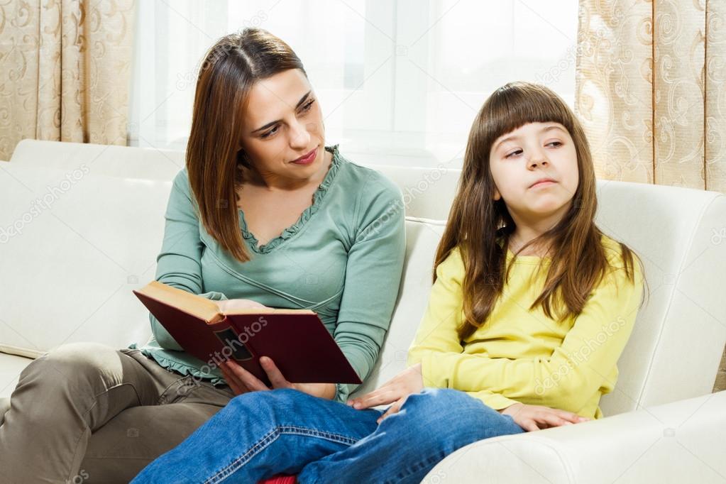 Mother and daughter with book