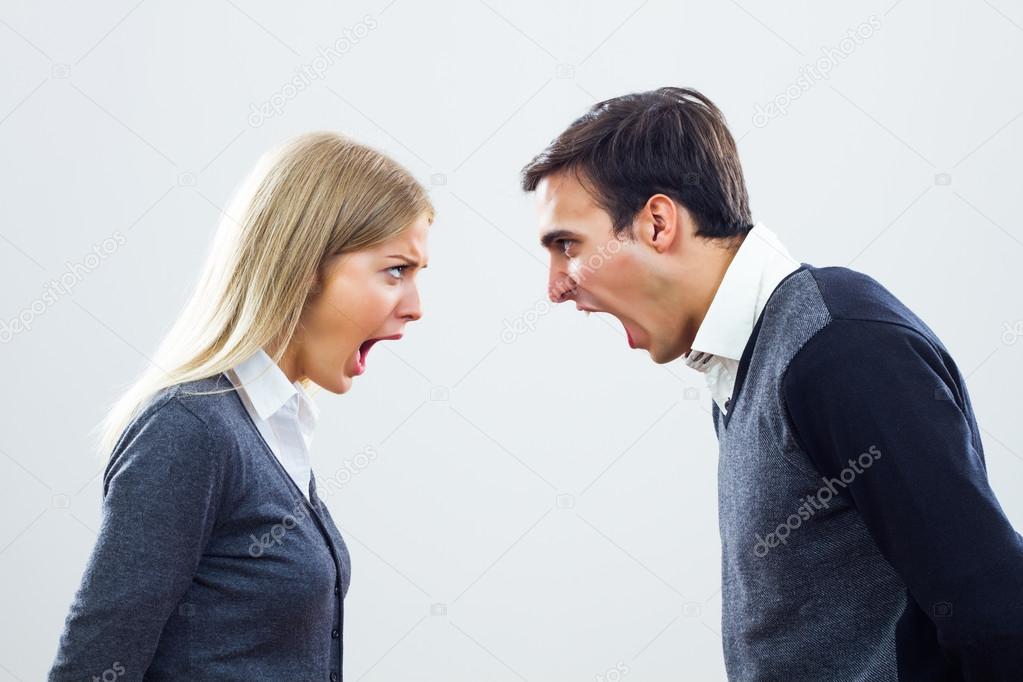 Businesswoman and businessman are screaming at each other