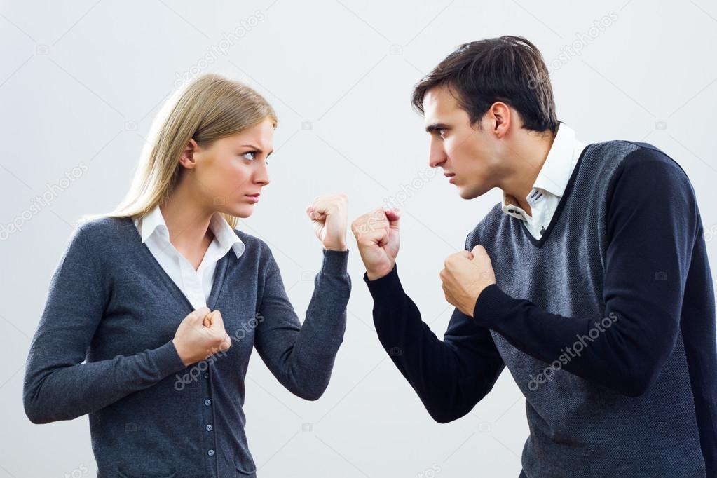 Businesswoman and businessman are very angry at each other