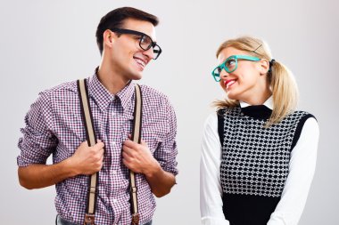 Shy nerdy woman and man are flirting clipart