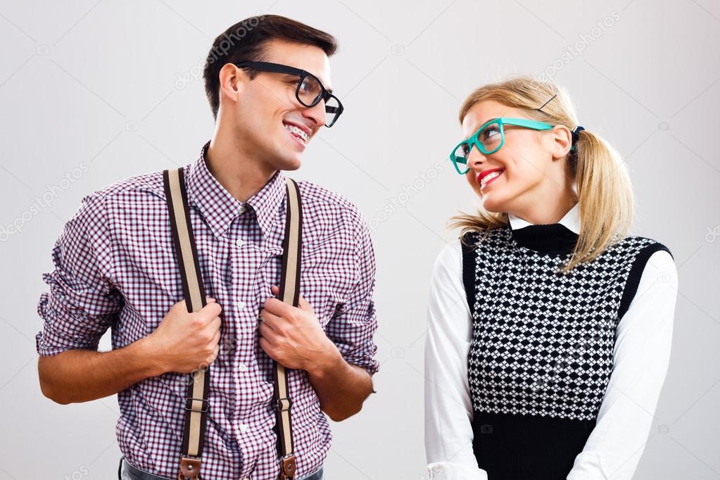 Shy nerdy woman and man are flirting