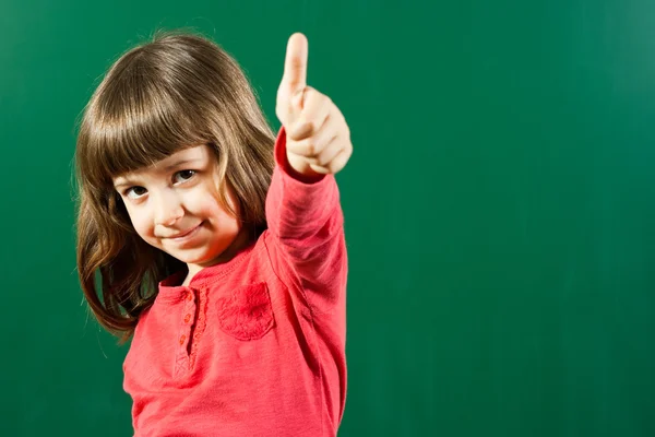 Carino bambina spettacolo pollice fino gesto — Foto Stock